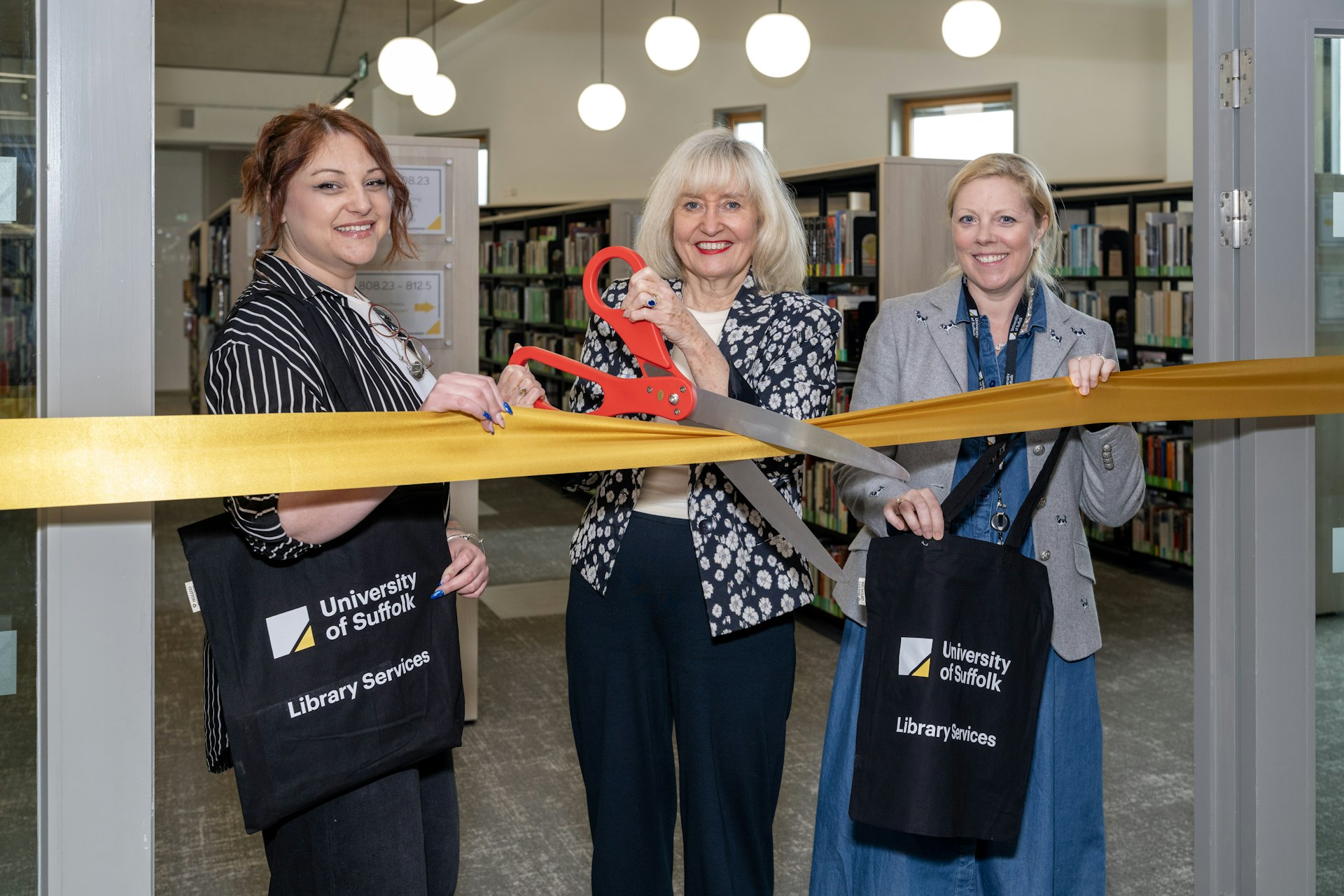 Left to right: Students' Union President of Education Lee-Ann Durrant, Vice-Chancellor Prof Jenny Higham and Pro Vice-Chancellor Education and Student Experience Prof Eloise Ellis cutting the ribbon for the library opening
